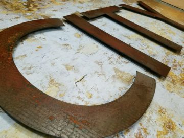 ¼” thick antiqued steel letters